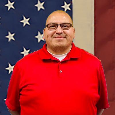 Benito_Flag_400sq Benito smiling in front of the American flag
